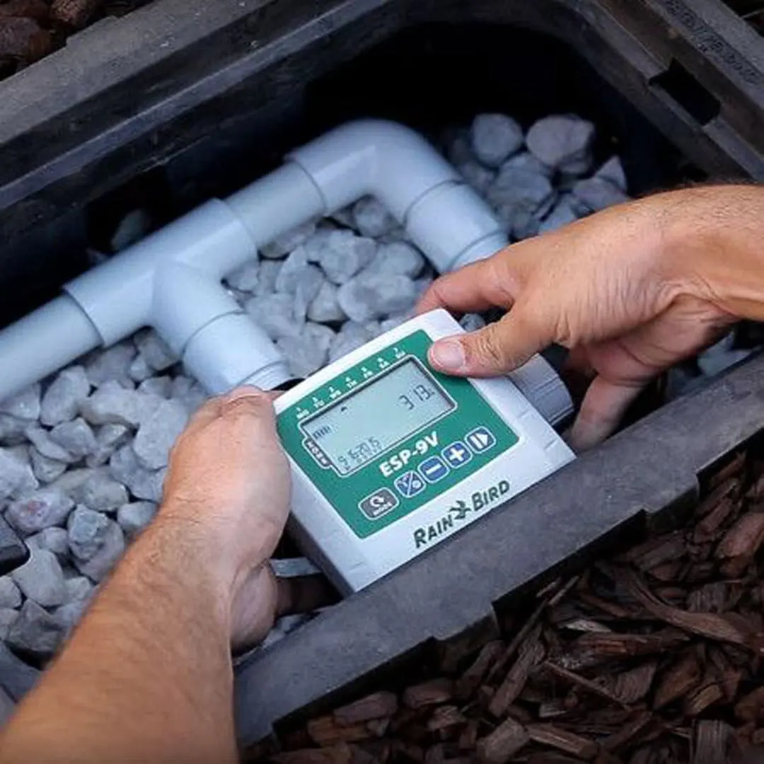 Technician testing an irrigation valve controller